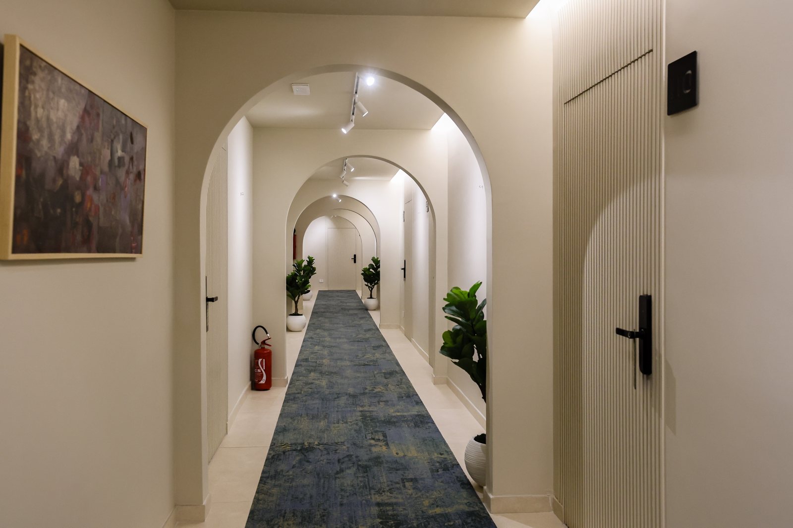 Art-lined corridor at A Gallery Hotel